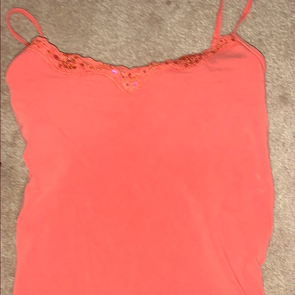 Tank with sequins and lace around top and bottom.